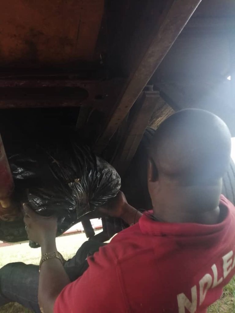 PHOTO NEWS: NDLEA Operatives Remove Drugs Concealed Under A Truck